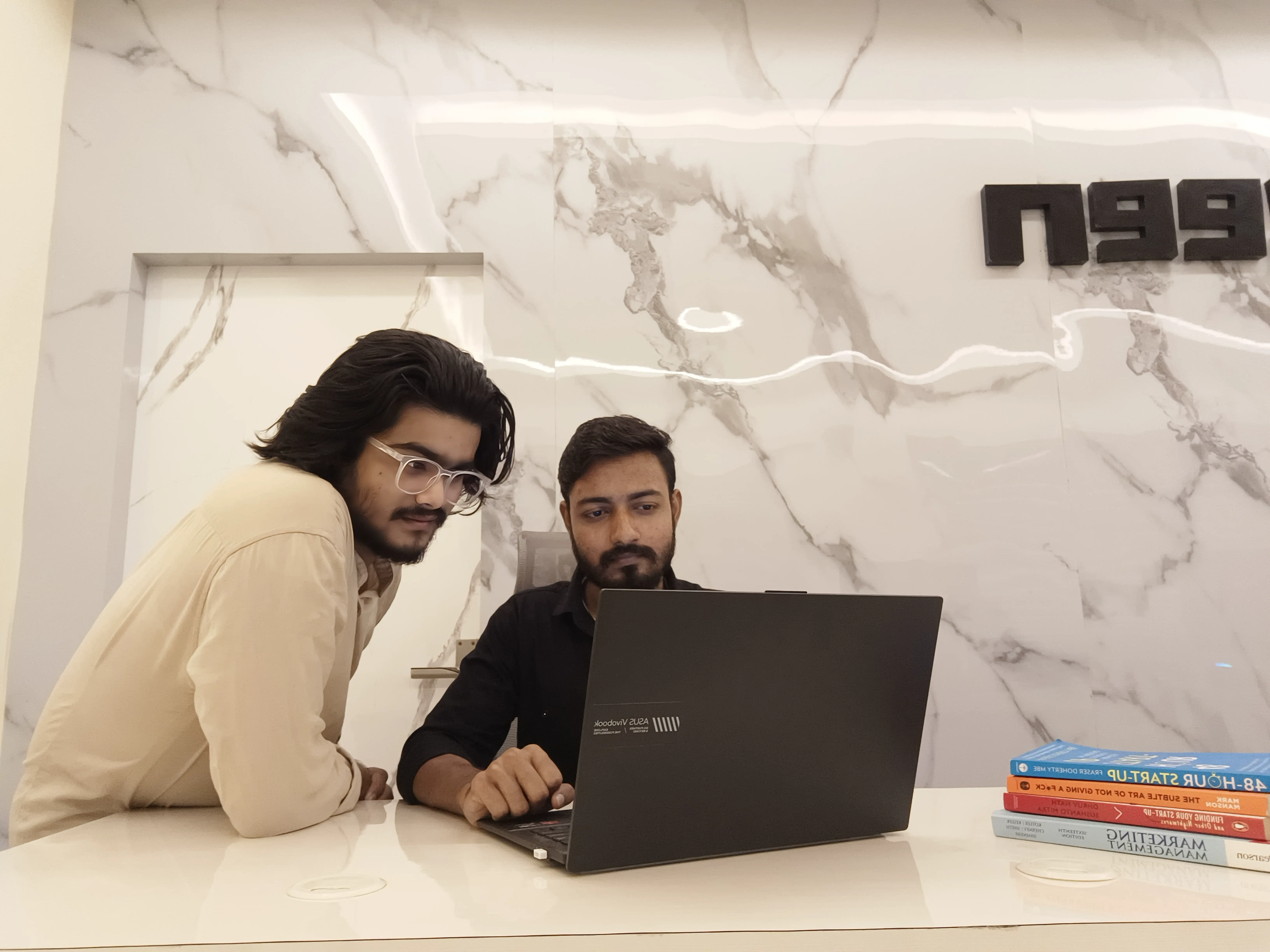 A collaborative team meeting, representing Oxzeen's purposeful approach to building digital brands.